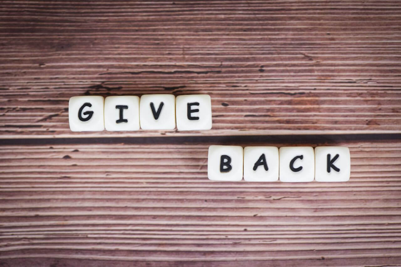 6 Ways Giving Back Improves Your Mental Health and Finances Budgeting Couple